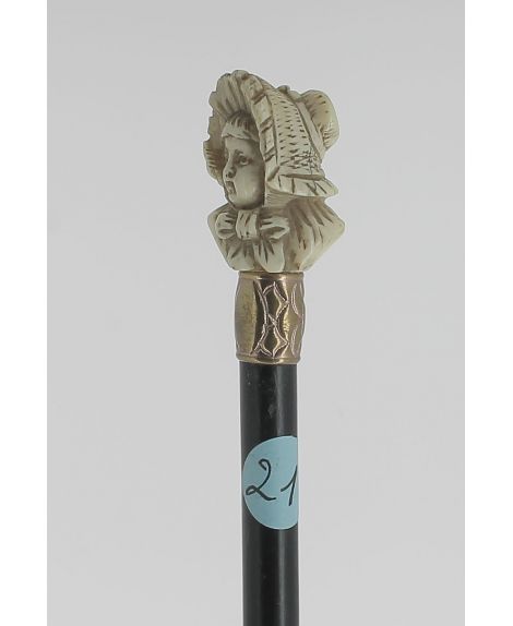 Ivory handle cane, young lady  with  wide-brimmed hat.