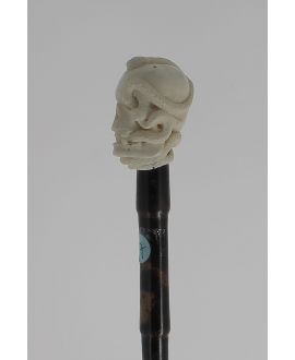 Ivory handle, skull with a snake