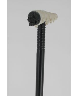 Ivory and ebony handle. Ivory is shaped as human vertebras and ebony like a skull