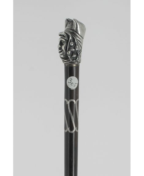 Erotic cane. Devil and but on the head