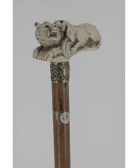 Ivory handle representing dog biting a boar. Malacca shaft
