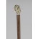 Erotic Ivory knob of a man head composed of many naked woman and in the back a couple making love.