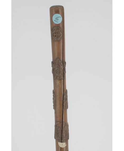 Wood cane with 20 countries emblems engraved